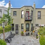 A Charming 4 Bd Garden Oasis Brick Townhouse